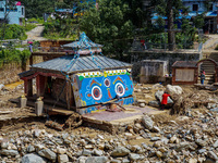 The Nakhu River flooding damages a temple in the Tikabhairab region of southern Lalitpur, Nepal, on October 1, 2024. Homes are severely dama...