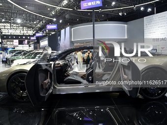 People visit the 2024 Hefei International New Energy Vehicle Exhibition in Hefei, China, on October 1, 2024. (