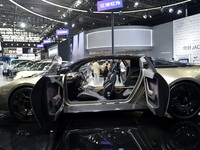 People visit the 2024 Hefei International New Energy Vehicle Exhibition in Hefei, China, on October 1, 2024. (