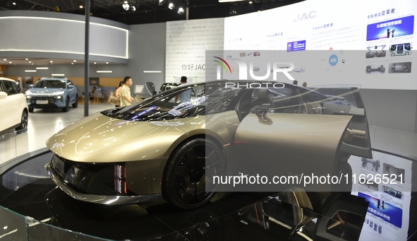 People visit the 2024 Hefei International New Energy Vehicle Exhibition in Hefei, China, on October 1, 2024. 