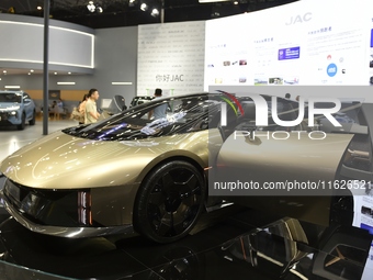 People visit the 2024 Hefei International New Energy Vehicle Exhibition in Hefei, China, on October 1, 2024. (