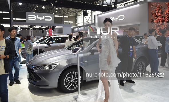 People visit the BYD booth at the 2024 Hefei International New Energy Vehicle Exhibition in Hefei, China, on October 1, 2024. 