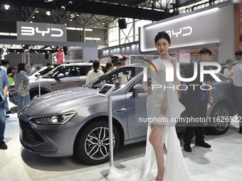 People visit the BYD booth at the 2024 Hefei International New Energy Vehicle Exhibition in Hefei, China, on October 1, 2024. (