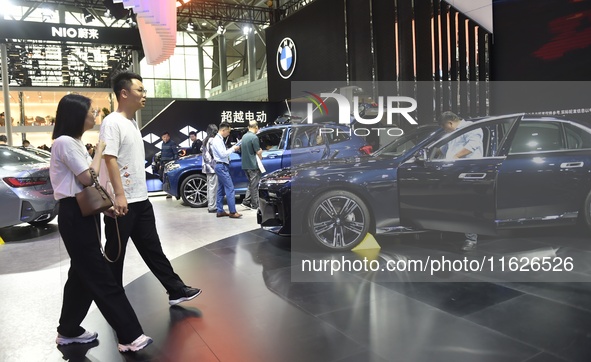 People visit the 2024 Hefei International New Energy Vehicle Exhibition in Hefei, China, on October 1, 2024. 