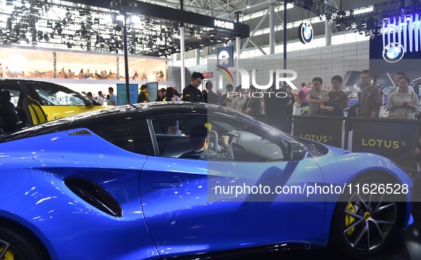 People visit the 2024 Hefei International New Energy Vehicle Exhibition in Hefei, China, on October 1, 2024. 