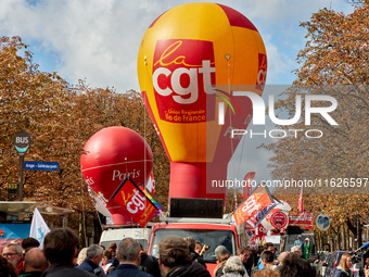 Demonstrators took part in a protest organized by the CGT union for strike action, demanding the repeal of the pension reform and higher wag...