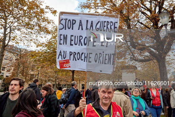 Demonstrators took part in a protest organized by the CGT union for strike action, demanding the repeal of the pension reform and higher wag...