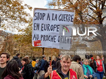 Demonstrators took part in a protest organized by the CGT union for strike action, demanding the repeal of the pension reform and higher wag...