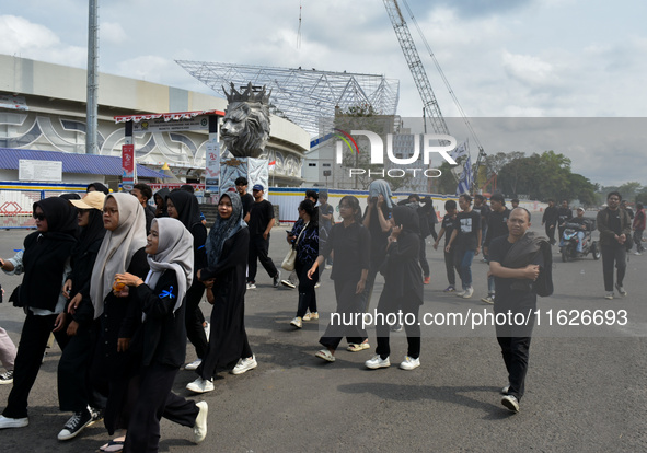 Hundreds of Arema FC supporters march to Kanjuruhan Stadium to mark the second anniversary of the football disaster that killed 135 people....