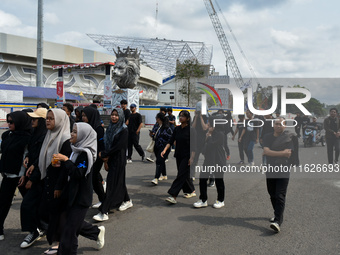 Hundreds of Arema FC supporters march to Kanjuruhan Stadium to mark the second anniversary of the football disaster that killed 135 people....