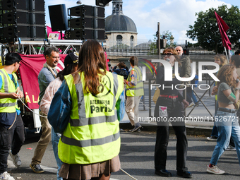 Environmentalists from Alternatia and MC Danse pour le climat demonstrate against Michel Barnier's government, in Paris, France, on October...