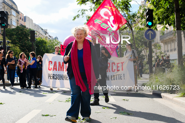 Students and university teachers demonstrate against Michel Barnier's government on this day of inter-professional strike action, in Paris,...