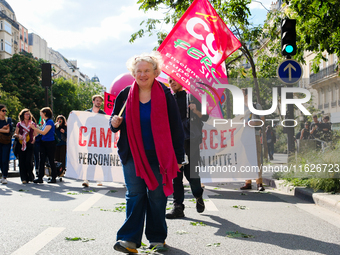 Students and university teachers demonstrate against Michel Barnier's government on this day of inter-professional strike action, in Paris,...