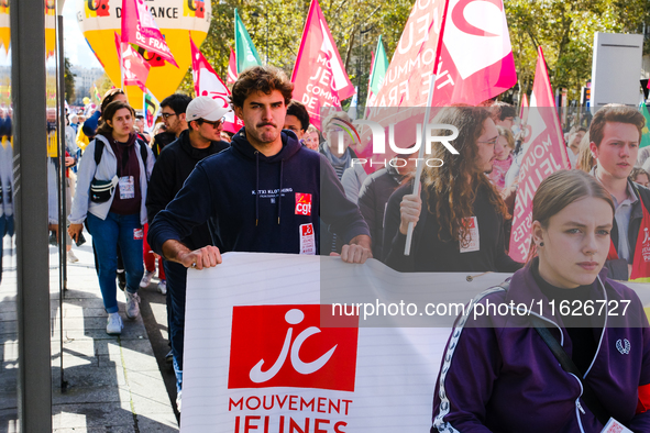 Activists from the Young Communist Movement demonstrate during the inter-professional strike day against the policies of Michel Barnier and...