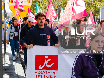 Activists from the Young Communist Movement demonstrate during the inter-professional strike day against the policies of Michel Barnier and...