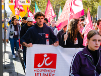 Activists from the Young Communist Movement demonstrate during the inter-professional strike day against the policies of Michel Barnier and...