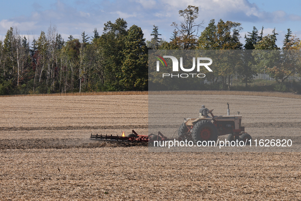 A farmer tills a soybean field after harvesting in Markham, Ontario, Canada, on September 30, 2024. 