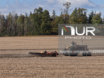 A farmer tills a soybean field after harvesting in Markham, Ontario, Canada, on September 30, 2024. (