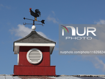 A weather vane sits atop a barn in Markham, Ontario, Canada, on September 30, 2024. (