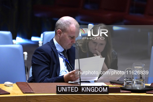 Fergus Eckersley, Minister Counsellor, at the Security Council  speaks during a Security Council meeting on migrant smuggling off the coast...