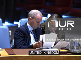 Fergus Eckersley, Minister Counsellor, at the Security Council  speaks during a Security Council meeting on migrant smuggling off the coast...