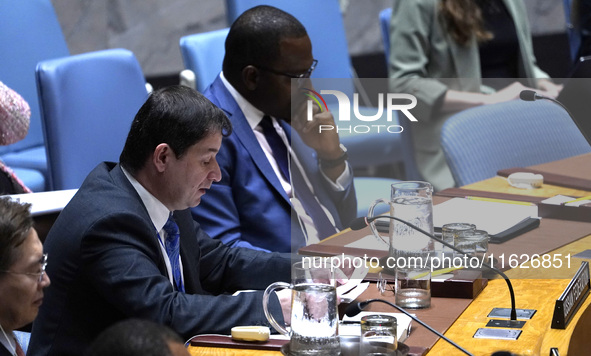 Russian First Deputy Permanent Representative to the UN Dmitry Polyansky speaks during a Security Council meeting on migrant smuggling off t...