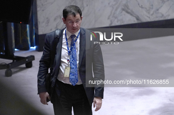 Russian First Deputy Permanent Representative to the UN Dmitry Polyansky exits during a Security Council meeting on migrant smuggling off th...