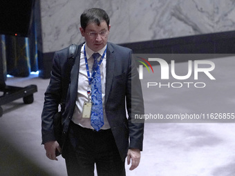 Russian First Deputy Permanent Representative to the UN Dmitry Polyansky exits during a Security Council meeting on migrant smuggling off th...