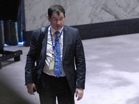 Russian First Deputy Permanent Representative to the UN Dmitry Polyansky exits during a Security Council meeting on migrant smuggling off th...