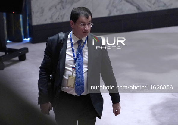 Russian First Deputy Permanent Representative to the UN Dmitry Polyansky exits during a Security Council meeting on migrant smuggling off th...