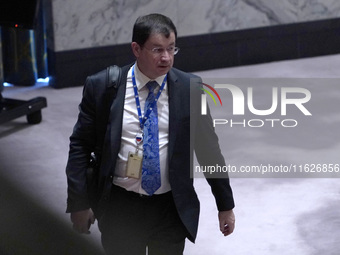 Russian First Deputy Permanent Representative to the UN Dmitry Polyansky exits during a Security Council meeting on migrant smuggling off th...