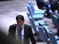 Russian First Deputy Permanent Representative to the UN Dmitry Polyansky exits during a Security Council meeting on migrant smuggling off th...