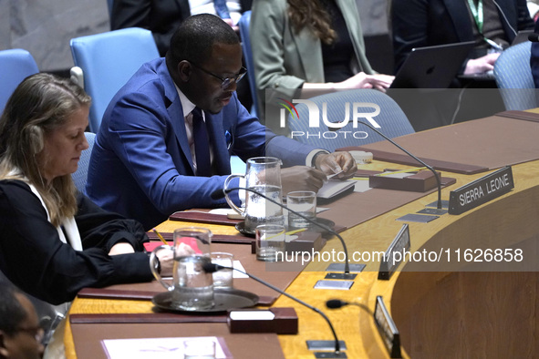 Michael Imran Kanu permanent representative  from Sierra Leone to the UN speaks during a Security Council meeting on migrant smuggling off t...