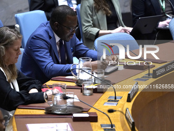 Michael Imran Kanu permanent representative  from Sierra Leone to the UN speaks during a Security Council meeting on migrant smuggling off t...