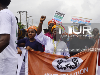 Activists stage a protest tagged #FearlessInOctober over increased hunger, insecurity, and economic hardship as Nigeria marks its 64th Indep...