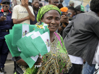 A woman sells Nigerian flags during a protest tagged #FearlessInOctober over increased hunger, insecurity, and economic hardship, as Nigeria...