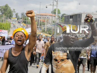 Activists stage a protest tagged #FearlessInOctober over increased hunger, insecurity, and economic hardship as Nigeria marks its 64th Indep...