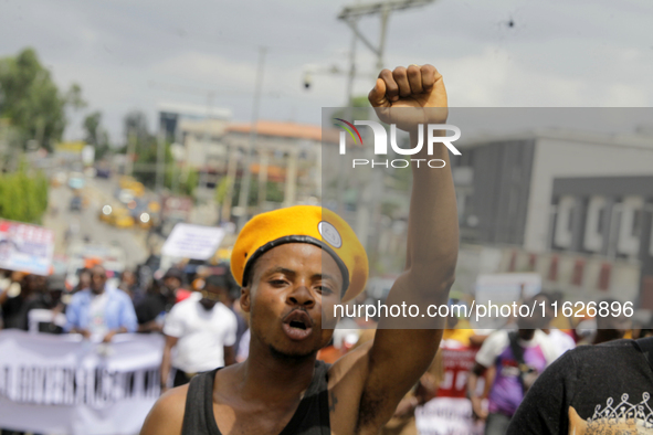 Activists stage a protest tagged #FearlessInOctober over increased hunger, insecurity, and economic hardship as Nigeria marks its 64th Indep...