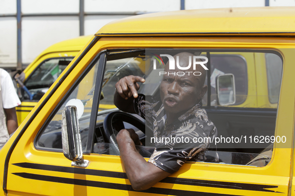 A commercial driver shows solidarity with activists during a protest tagged #FearlessInOctober over increased hunger, insecurity, and econom...