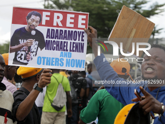 Activists stage a protest tagged #FearlessInOctober over increased hunger, insecurity, and economic hardship as Nigeria marks its 64th Indep...