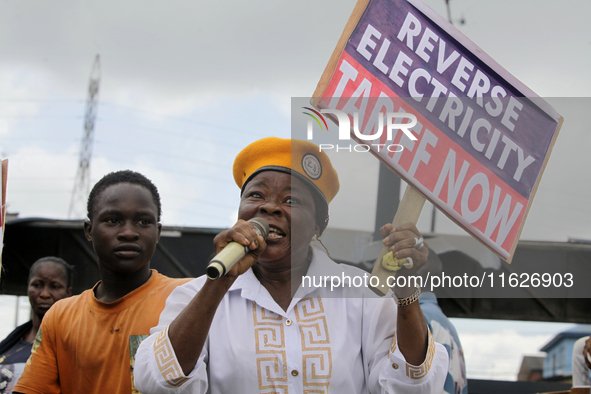 Activists stage a protest tagged #FearlessInOctober over increased hunger, insecurity, and economic hardship as Nigeria marks its 64th Indep...