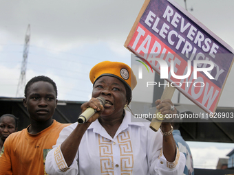 Activists stage a protest tagged #FearlessInOctober over increased hunger, insecurity, and economic hardship as Nigeria marks its 64th Indep...