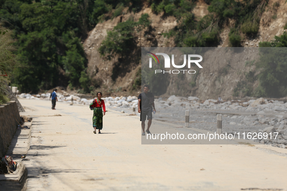 Nepali passengers travel through the BP Highway, a major highway that connects Kathmandu directly with the Southern Plains of Nepal, making...