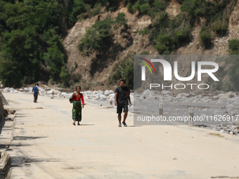 Nepali passengers travel through the BP Highway, a major highway that connects Kathmandu directly with the Southern Plains of Nepal, making...