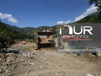 A house sustains damage from flooding in Kavrepalanchowk District along the BP Highway of Nepal, on October 1, 2024. (