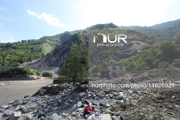 A house sustains damage from flooding in Kavrepalanchowk District along the BP Highway of Nepal, on October 1, 2024. 