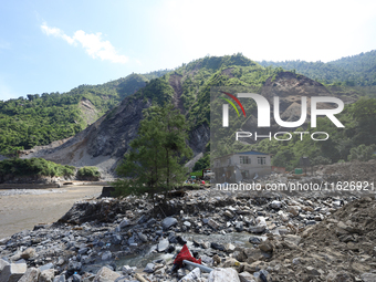 A house sustains damage from flooding in Kavrepalanchowk District along the BP Highway of Nepal, on October 1, 2024. (