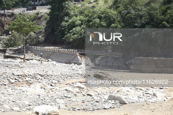 A section of BP Highway, a major highway that connects Kathmandu directly with the Southern Plains of Nepal, is damaged by a landslide in Ka...