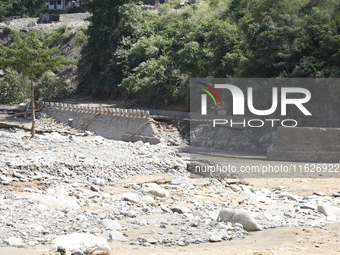 A section of BP Highway, a major highway that connects Kathmandu directly with the Southern Plains of Nepal, is damaged by a landslide in Ka...