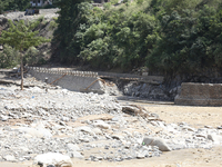 A section of BP Highway, a major highway that connects Kathmandu directly with the Southern Plains of Nepal, is damaged by a landslide in Ka...